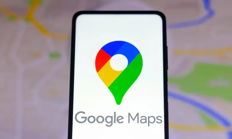 Close-up of a smartphone displaying the Google Maps logo and app name.