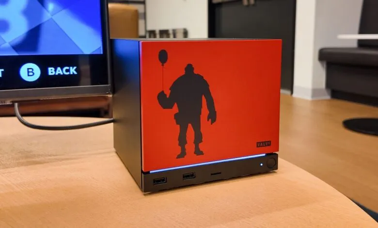 Valve Steam Deck console with Heavy silhouette holding balloon.