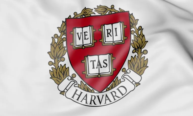 Harvard University flag featuring the Veritas shield emblem.