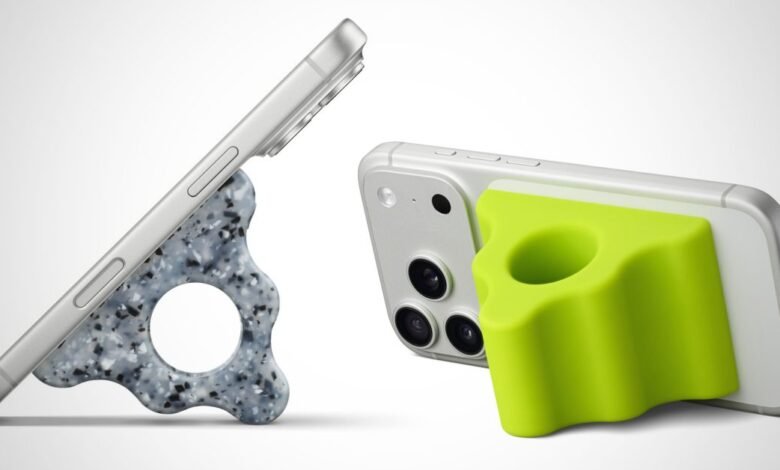 Two smartphones are shown with colorful grip stands attached, one in terrazzo pattern and one in bright green.