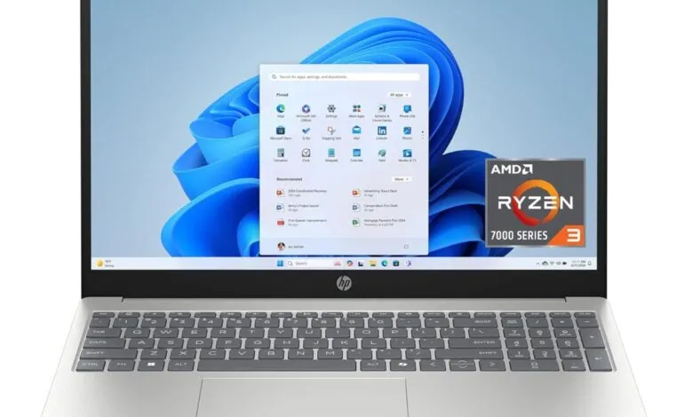 HP laptop displaying Windows 11 start menu and AMD Ryzen 3 processor badge.