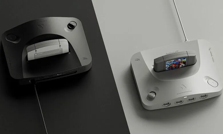 Two Analogue 3D consoles, one black and one white, with game cartridges inserted.