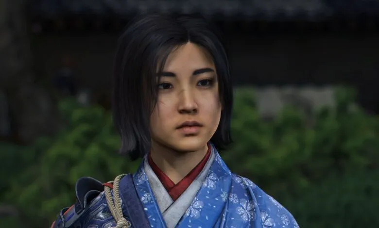 Close-up of a young woman with dark hair, wearing traditional Japanese attire.