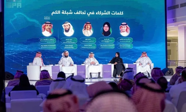 Panelists at a conference discussing partnerships in the digital network.