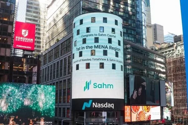 A cylindrical building in Times Square displays a message congratulating Sahm Capital for being 1st in the MENA Region.