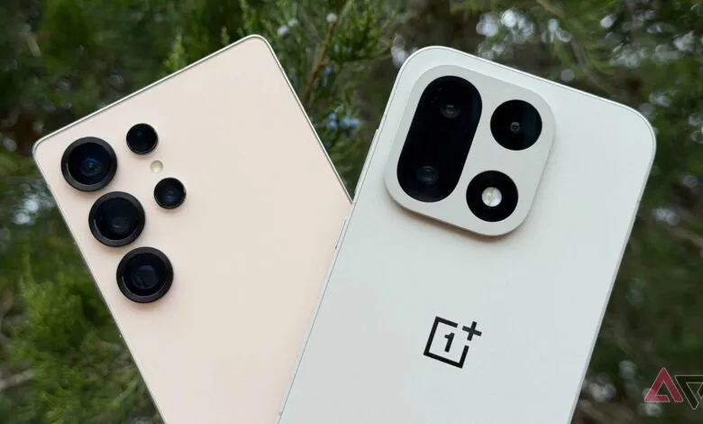 Close-up of the camera arrays on two modern smartphones, one beige and one white.
