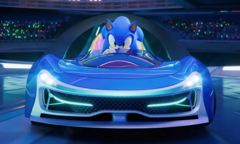 Sonic the Hedgehog in a futuristic blue race car with glowing accents.