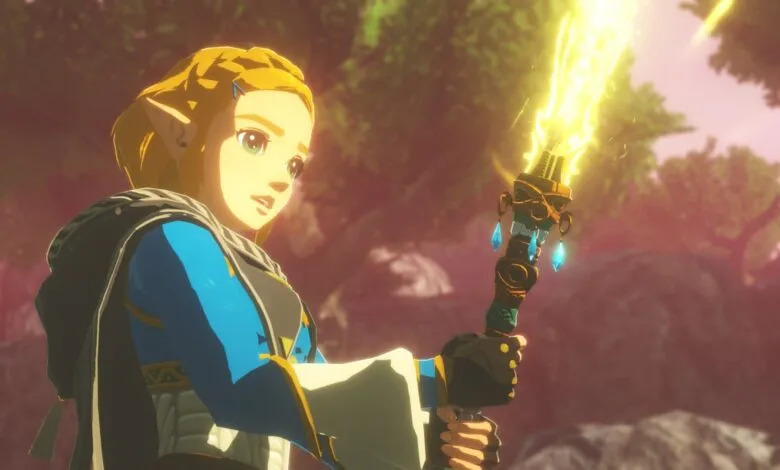 Princess Zelda holding a glowing, ornate staff in a forest setting.