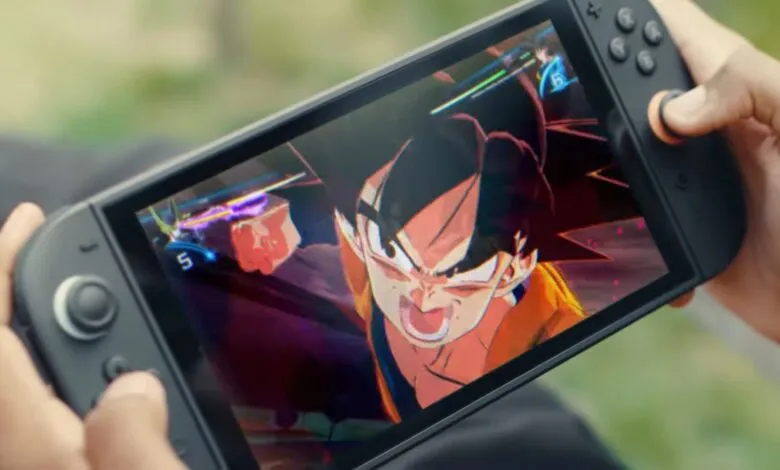 Person playing Dragon Ball Z game on a portable gaming device.