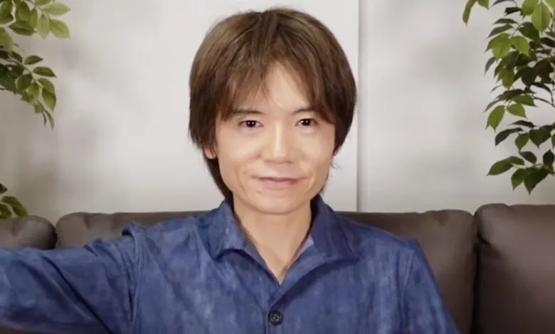 Masahiro Sakurai, creator of Kirby and Super Smash Bros., smiles at the camera.