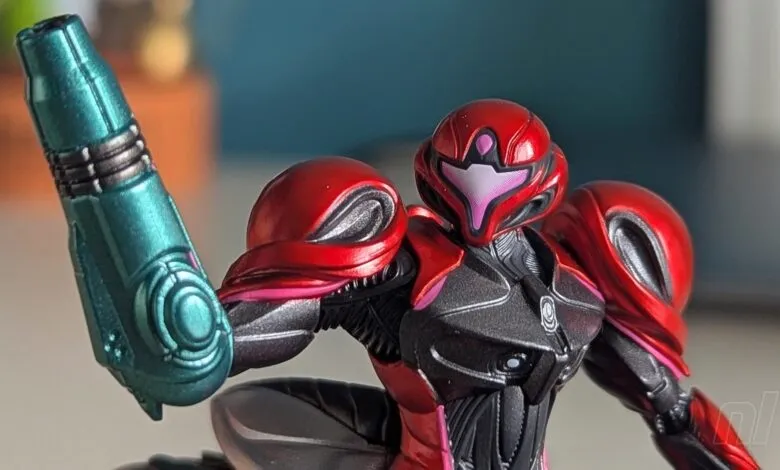 Close-up of a Samus Aran action figure in her red and black suit.