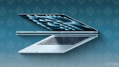 Three silver Apple MacBooks arranged on a blue snowflake patterned background.