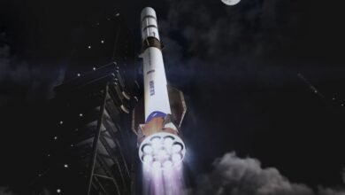 Blue Origin New Glenn rocket launching at night with bright engine exhaust.