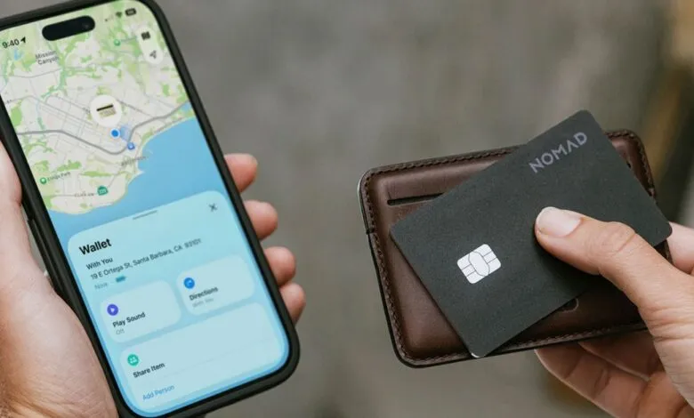 Person holding iPhone showing a map with a wallet icon and a brown leather wallet with a black card.