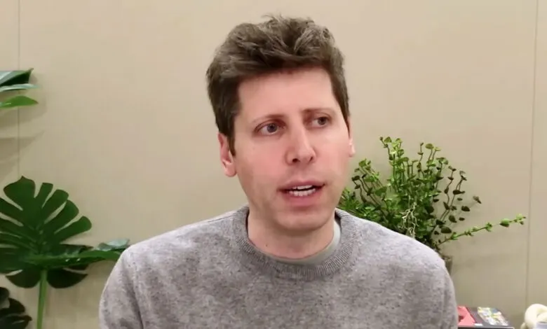 Sam Altman, CEO of OpenAI, speaking during an interview, wearing a grey sweater.
