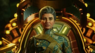 A woman with graying hair and a stern expression wears a futuristic uniform.
