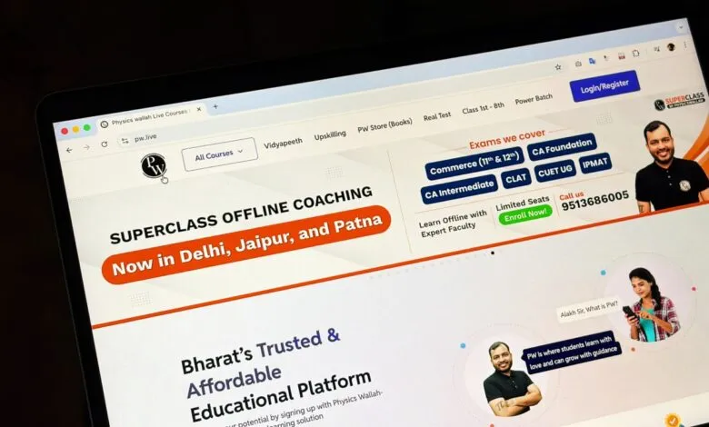 Laptop screen displaying the Physics Wallah website with offline coaching information.