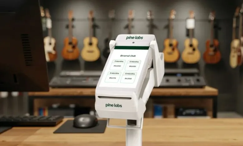 Pine Labs point-of-sale terminal displaying EMI options in a retail store.