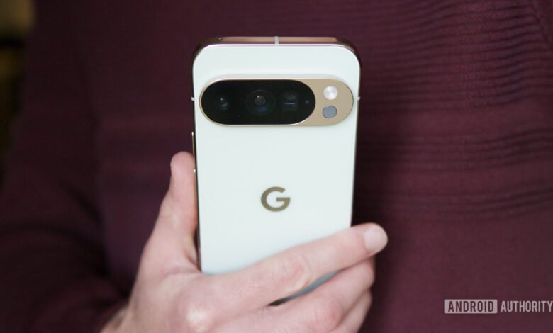 Close-up of the back of a white Google Pixel 7 Pro smartphone held in a hand.
