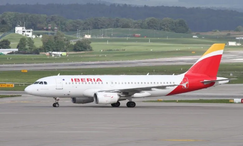 Iberia Airbus A320 aircraft on the tarmac, ready for takeoff.