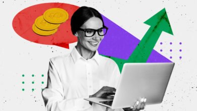 Woman in glasses smiling while working on a laptop with abstract graphics of coins and growth charts.