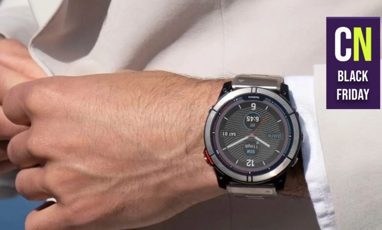 Close-up of a Garmin Quatix smartwatch on a wrist, Black Friday ad.