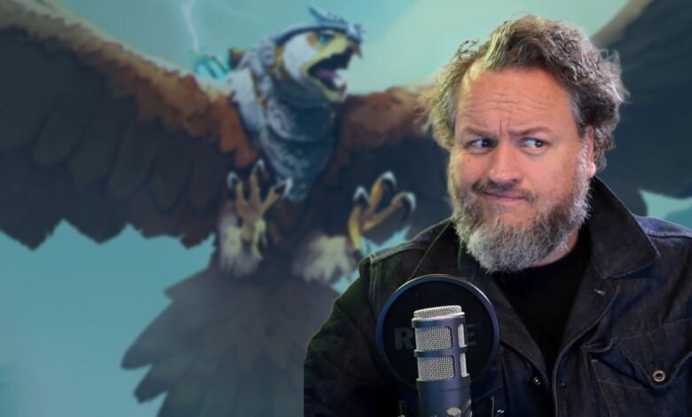 Man with beard and denim jacket looking to the side, with a fantasy bird creature behind him.