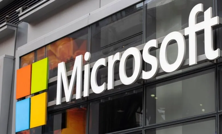 Close-up of the Microsoft logo and building signage with its iconic four-color window pane.