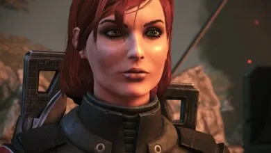 Close-up of a female character with red hair and green eyes, wearing tactical armor.