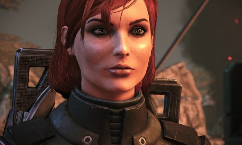 Close-up of a female character with red hair and green eyes, wearing tactical armor.