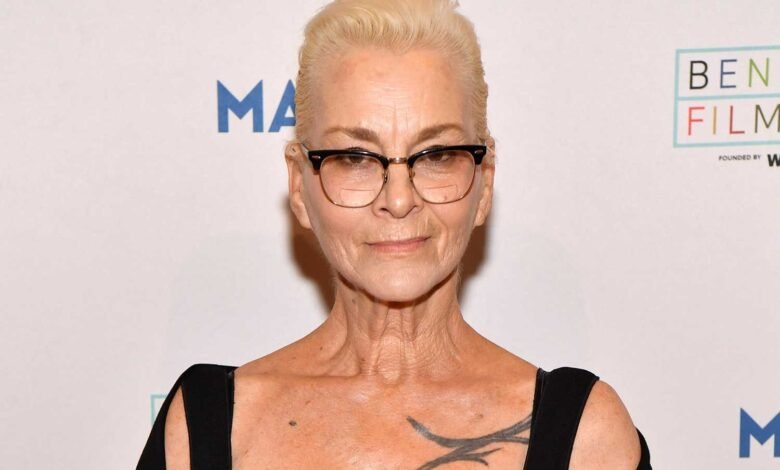 Susan Powter poses at the Bentonville Film Festival, smiling slightly.