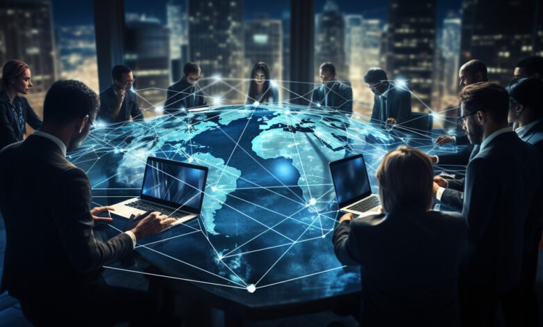 Business professionals in a meeting around a table with a holographic globe and laptops.