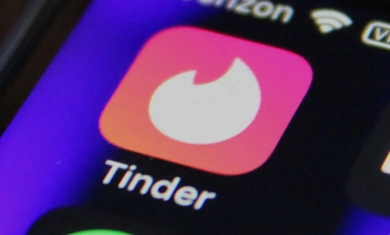 Close-up of the Tinder app icon on a smartphone screen.