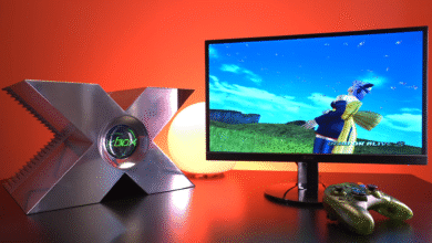 Original Xbox console and controller with Dead or Alive 3 on screen