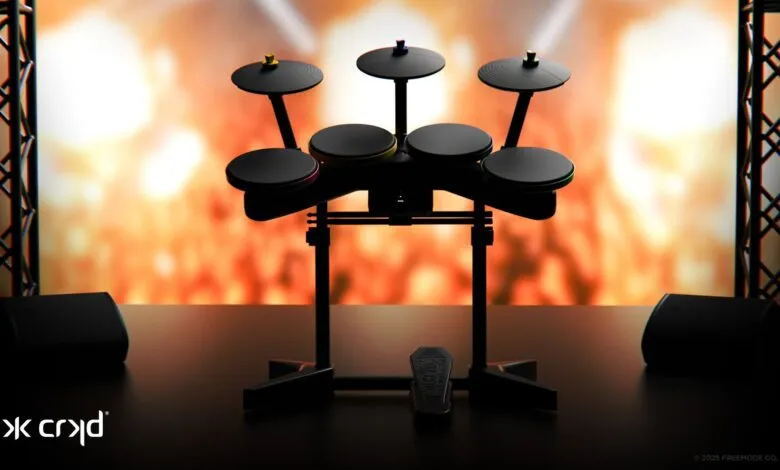 Electronic drum kit with colorful accents on a stage with bright lights.