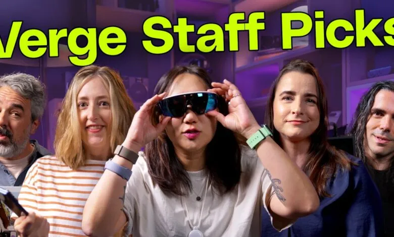 Five Verge staff members pose for a group shot, showcasing their favorite tech.