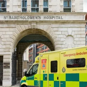 Ambulance parked in front of St. Bartholomew's Hospital entrance.