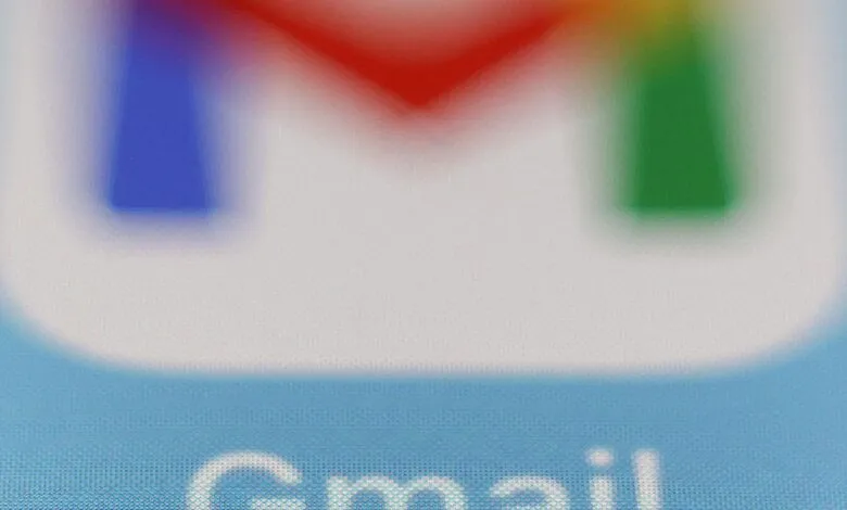 Close-up of the Gmail logo with blurred, vibrant colors.
