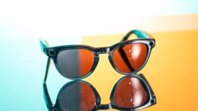 Ray-Ban Meta smart glasses with camera on reflective surface.