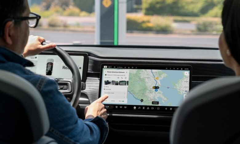Driver uses Rivian's navigation system to find nearby charging stations.