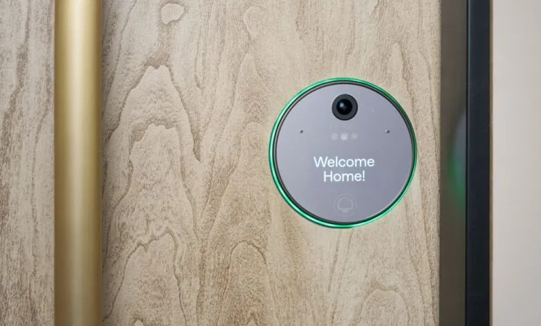 Doma smart home device on wooden door with 'Welcome Home!' message.