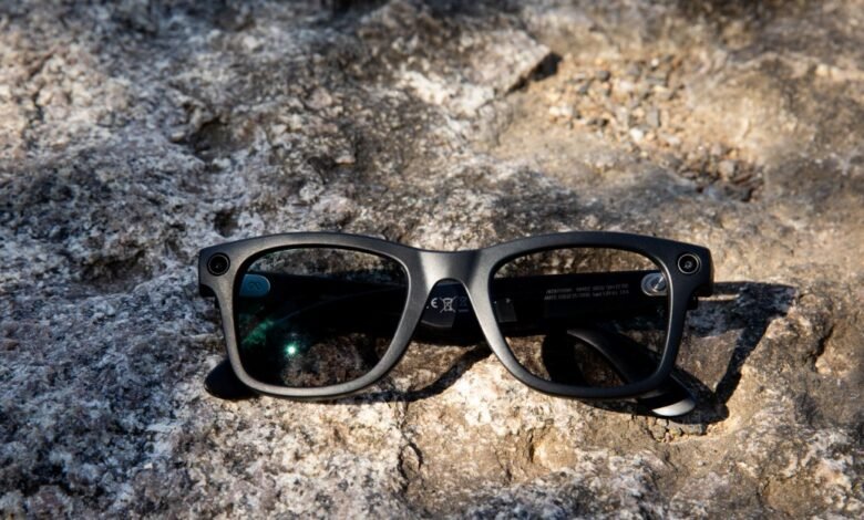 Ray-Ban Meta smart glasses with camera on textured rock surface.