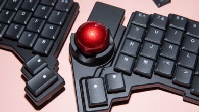 Ergonomic split keyboard with trackball for comfortable typing.