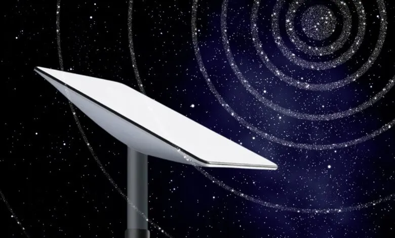 Starlink dish against a starry night sky with spiral galaxy effect.