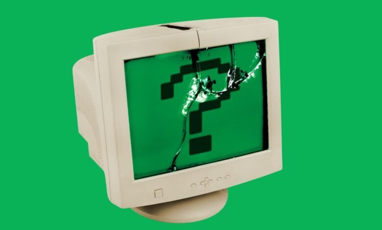 Broken computer monitor displays a pixelated green question mark.
