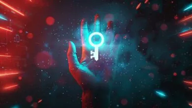 Hand holding glowing key in digital space, security concept.