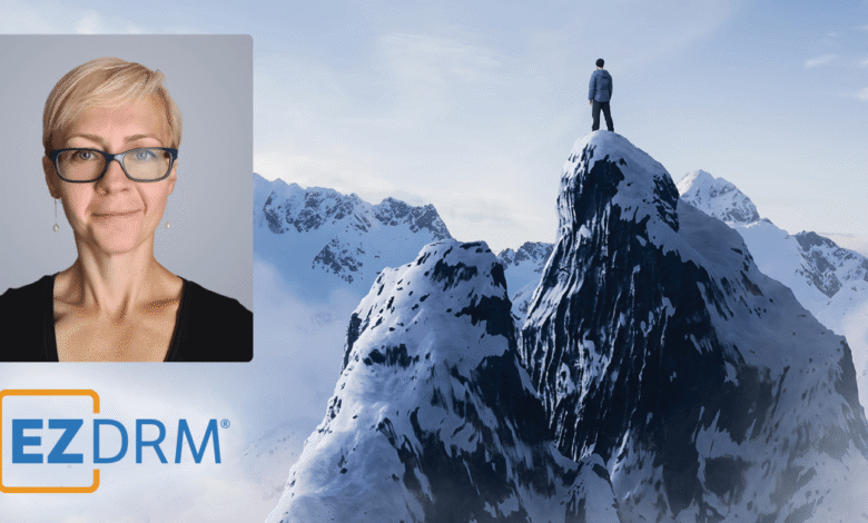 Woman's portrait and man on mountain peak with EZDRM logo.