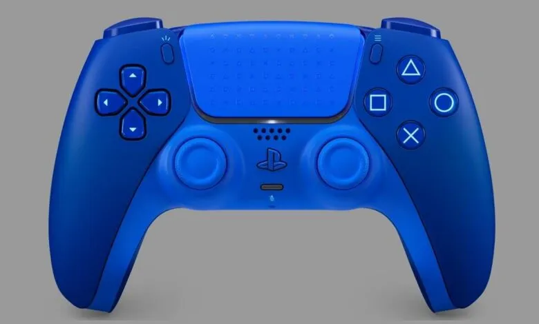 Close-up of a blue PlayStation 5 DualSense controller on a gray background.