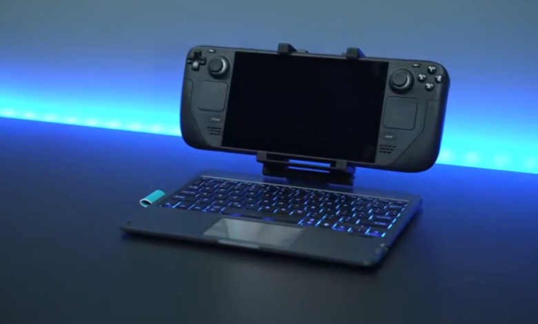 Steam Deck mounted on keyboard with blue backlight, dark background.