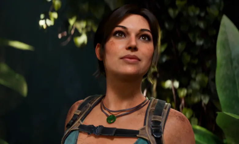 Lara Croft looks up in a lush jungle environment, wearing her signature necklace.